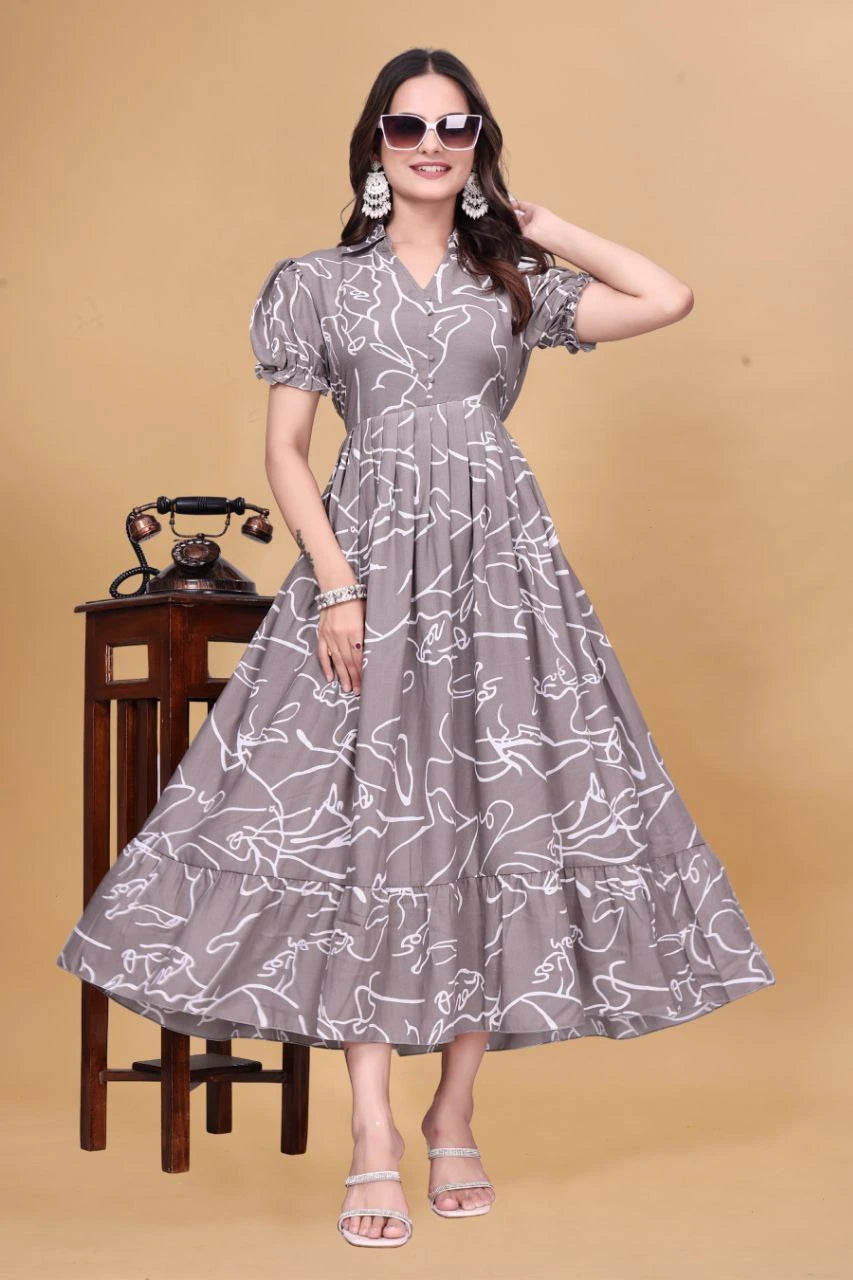 Woman wearing a gray dress with white patterns on a beige background